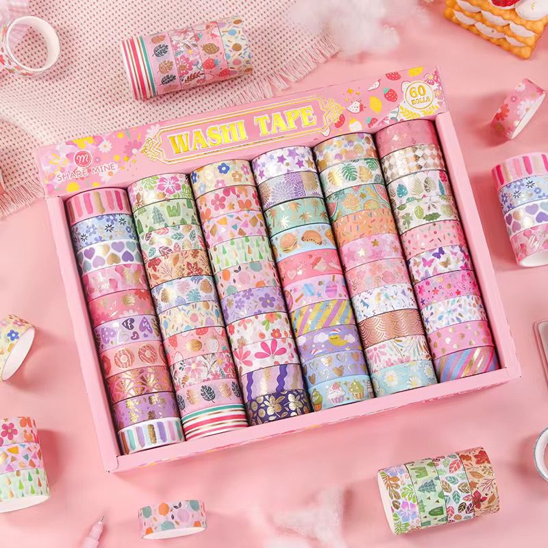 Pastel Pattern Washi Tape Mega SetDecorative Washi TapeCRAFTY CUDDLESet of colorful washi tape rolls in a decorative box on a pink backgroundart journalingbotanical tape