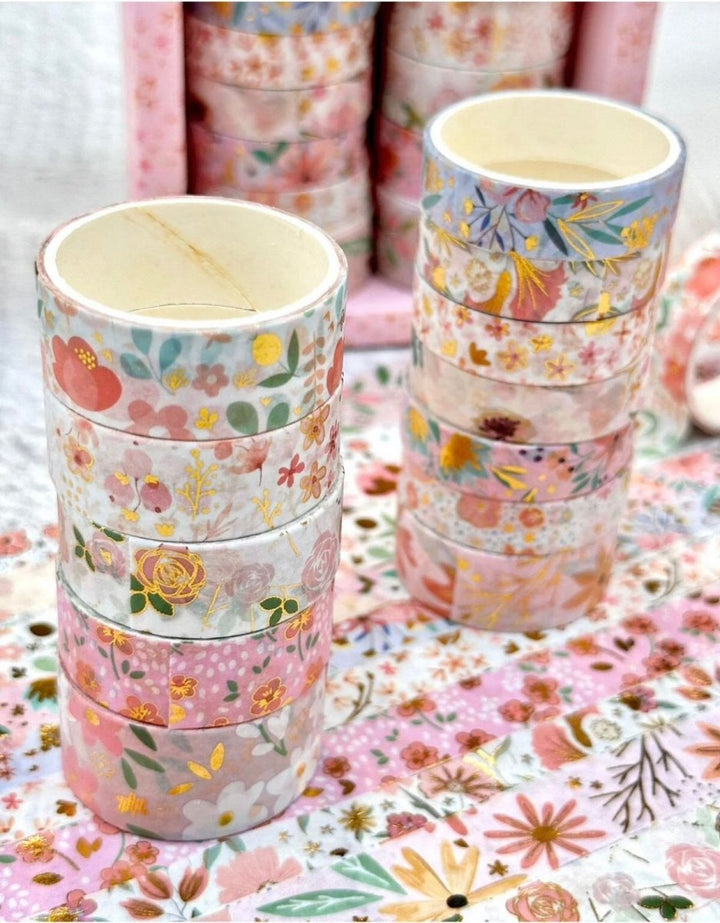 Pink Floral Washi Tape SetDecorative Washi TapeCRAFTY CUDDLEStacks of floral - patterned paper rolls on a floral backgroundart journalingbotanical tape