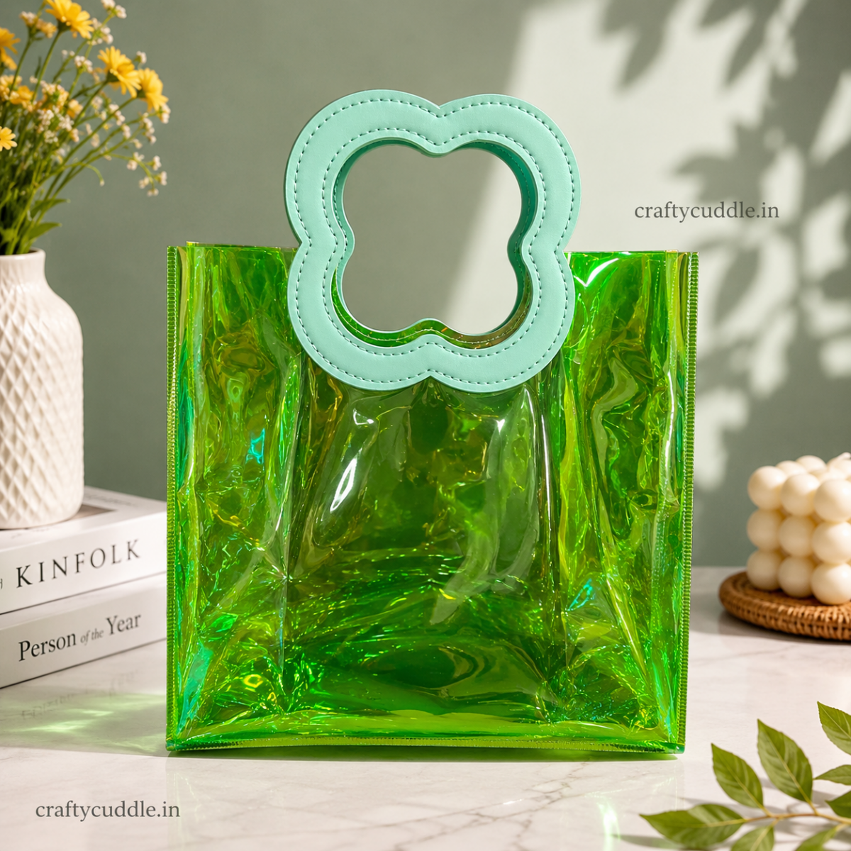 Pretty Shimmer Tote BagTransparent bagCrafty CuddleA translucent green acrylic tote bag with a mint green cloud-shaped handle, styled on a marble surface with decorative props including books, flowers, and a candle.GreenGiftHampers GiftPackaging GiftBag IridescentBag GiftIdeas ReturnGifts PartyFavours BirthdayGifts FestiveGifting GiftWrap TrendyBags ReusableBag