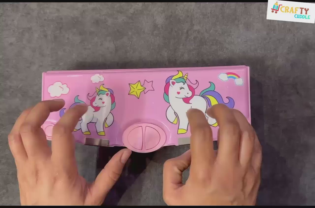 Pink multi-compartment pencil box with a unicorn pattern, ideal for organizing stationery.