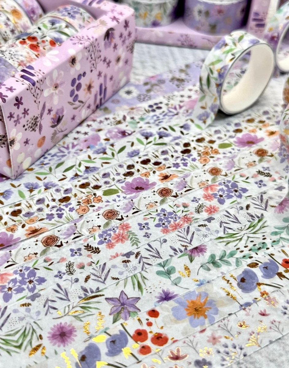 Purple Floral Washi Tape SetDecorative Washi TapeCRAFTY CUDDLEFloral - patterned paper with rolls and a box on a light backgroundart journalingbotanical tape
