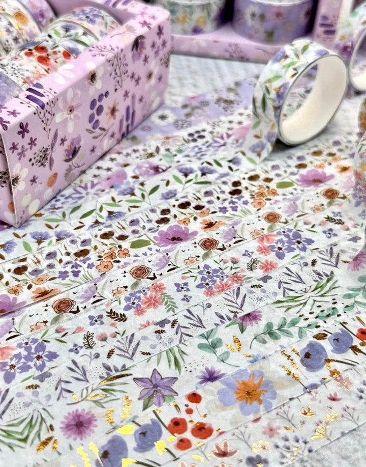 Purple Floral Washi Tape SetDecorative Washi TapeCRAFTY CUDDLEFloral - patterned paper with rolls and a box on a light backgroundart journalingbotanical tape
