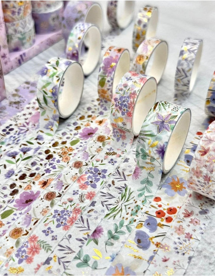Purple Floral Washi Tape SetDecorative Washi TapeCRAFTY CUDDLERolls of floral - patterned tape on a white surfaceart journalingbotanical tape
