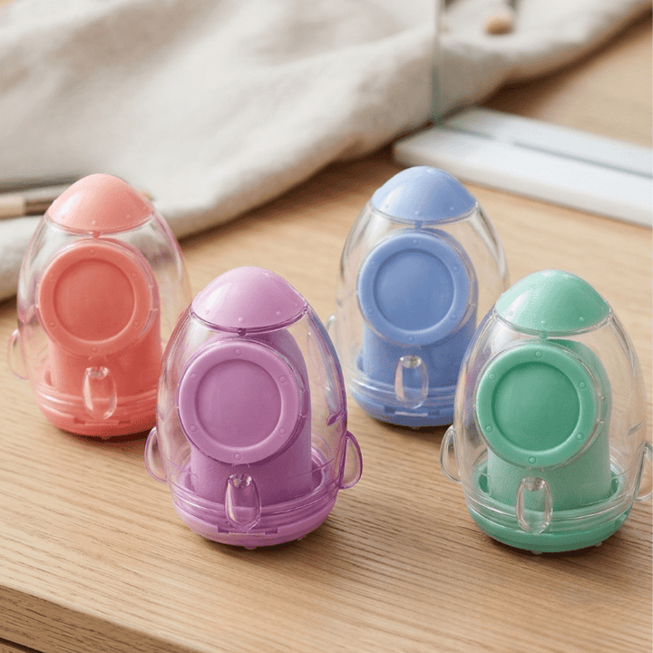Rocket Blast Pencil SharpenerCrafty CuddleFour colorful plastic sharpeners on a wooden surface1