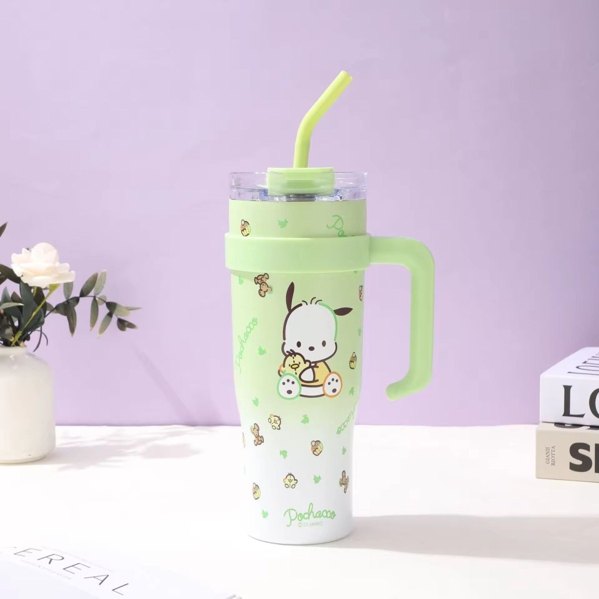 Sanrio Stainless Steel Insulated TumblerTumblersCRAFTY CUDDLEGreen tumbler with a handle and straw on a white surface with a purple backgroundLight GreenStainlessSteelTumbler InsulatedCup CuteDrinkware KawaiiStyle CartoonTumbler TravelMug HotAndCold ReusableCup AestheticVibes GiftIdeas