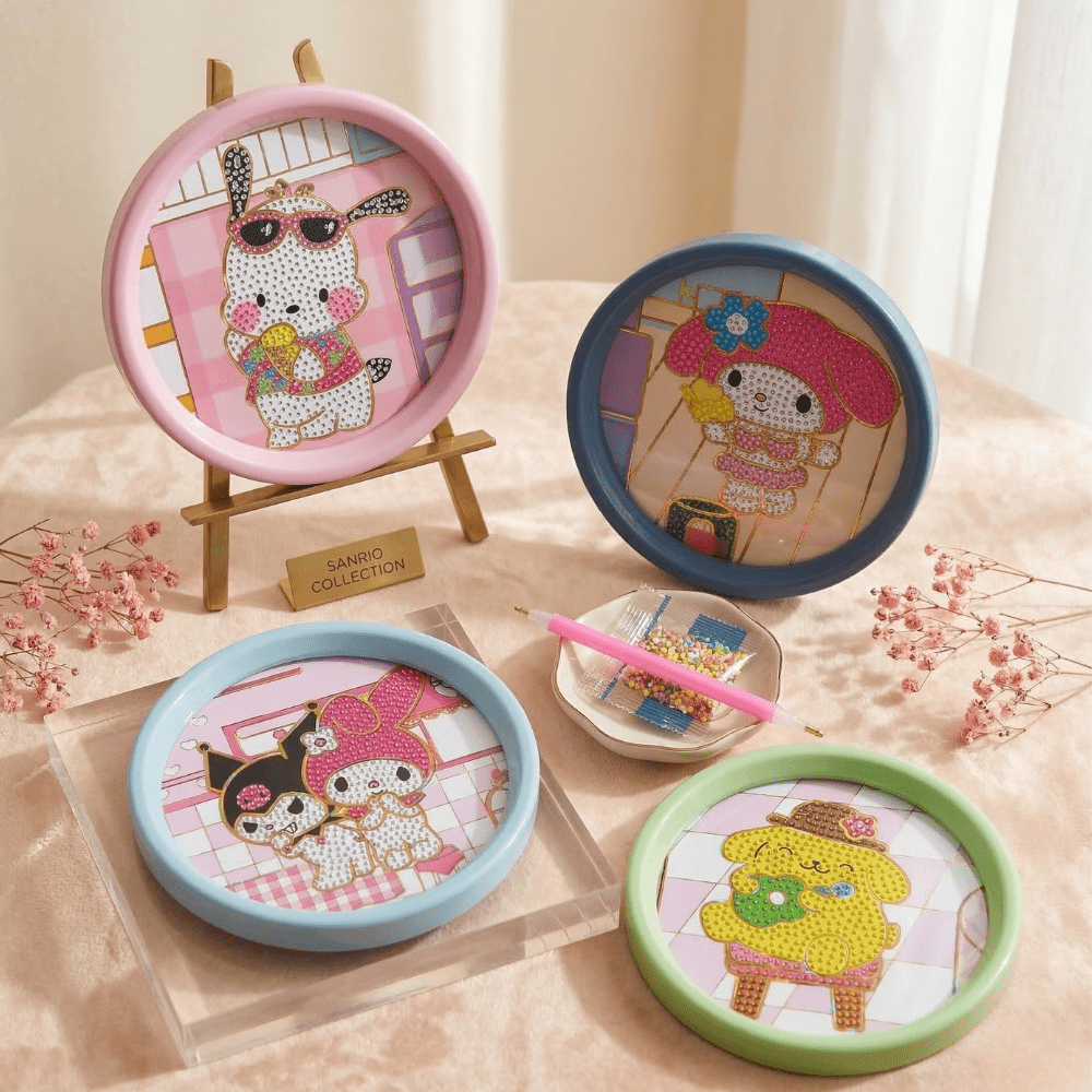 Sanrio Theme DIY Diamond Painting Coaster KitDIY KitsCrafty CuddleFour round DIY kits with cartoon characters on a light pink surface.