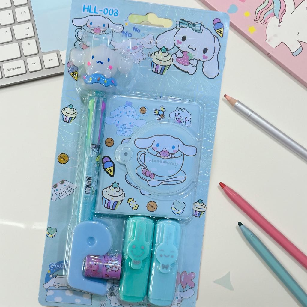 Kawaii stationery set with cartoon character packaging on a desk.
