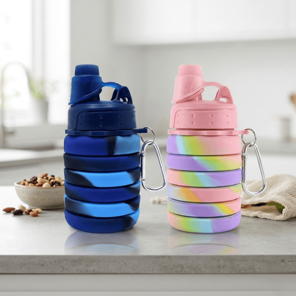 Silicone Collapsible Sipper BottleSilicone Water BottleCrafty CuddleCollapsible water bottles in blue and multicolored on a kitchen counter.Silicone Bottle PinkPinkBPA free bottlecollapsible water bottle
