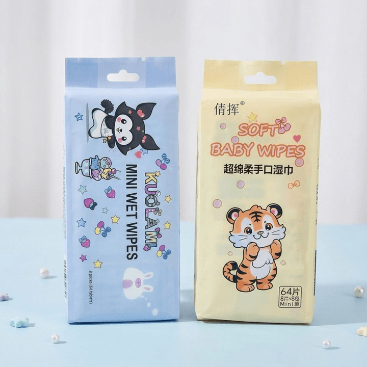 Soft Baby Wet Wipes Pack of 64Wet WipesCrafty CuddleTwo packages of baby wipes with cartoon characters on a light blue backgroundBabyWipes SoftBabyWipes MiniWetWipes BabyCareEssentials GentleBabyCare TravelWipes KidsHygiene BabyProducts HandAndMouthWipes ParentingEssentials