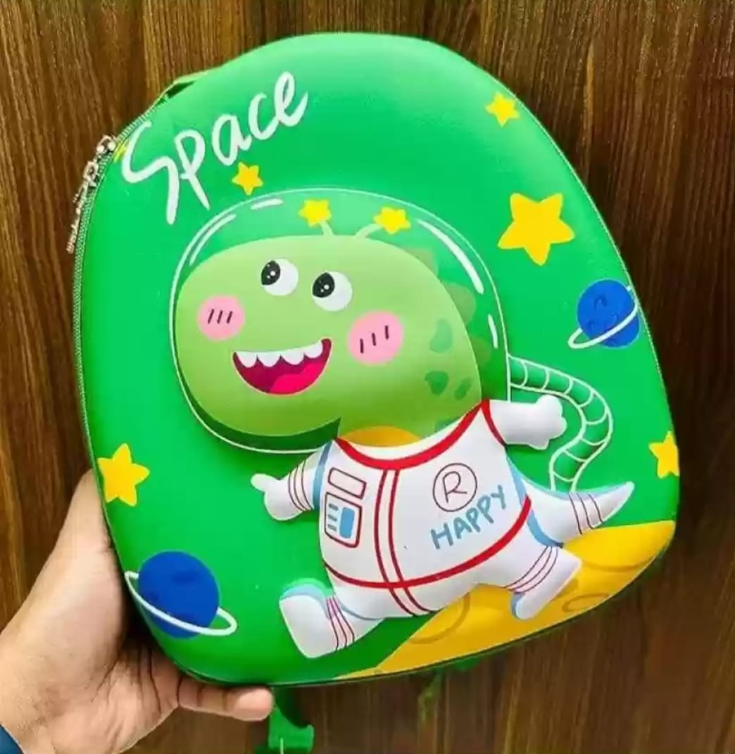 Green bag with a cartoon dinosaur in an astronaut suit and 'Space' text on a wooden surface