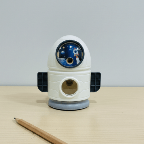 Space - Themed Pencil SharpenerStationery > Erasers &amp; SharpenersCRAFTY CUDDLERobot - shaped pencil sharpener on a light surface with a pencil next to itWhiteKidsStationery SpaceTheme CuteStationery SchoolSupplies KawaiiStationery BackToSchool StationeryAddict StudyEssentials ReturnGiftIdeas StationeryLove