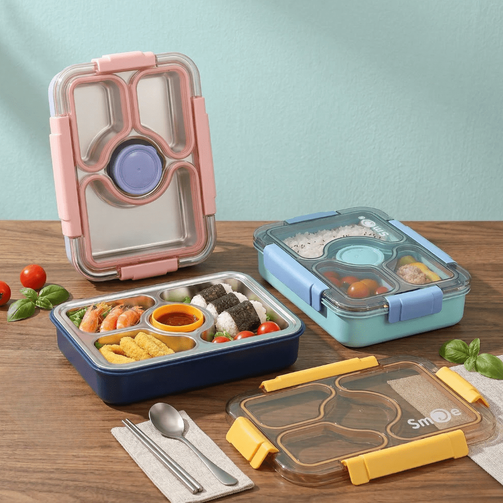Stainless Steel Bento Lunch BoxStainless Steel Lunch BoxCrafty CuddleThree bento boxes with compartments filled with food on a wooden table.Bluelunchbox bentobox kidslunchbox schoollunch bentolunchbox lunchboxideas leakprooflunchbox stainlesssteellunchbox schoolessentials kitchenessentials