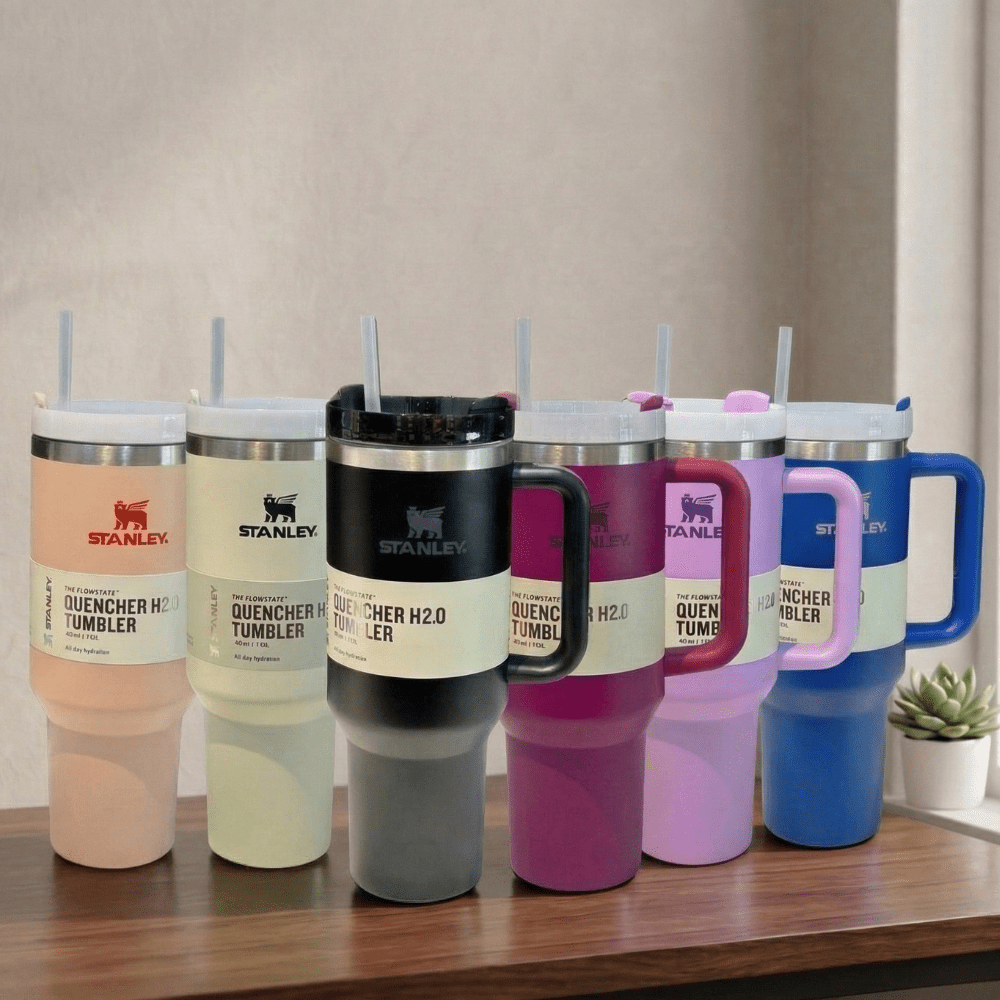 Stanley TumblerDrinkwareCrafty CuddleSet of Stanley tumblers in various colors on a wooden surface with a neutral background.Stanley Tumbler-6Hot PinkAestheticVibesAmazonFinds