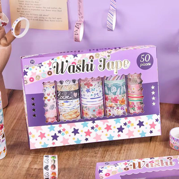 Star Pattern Washi Tape – 50 RollsDecorative Washi TapeCRAFTY CUDDLEBox of washi tape with colorful designs on a wooden surfacewashitape washitapelove washitapecollection papercrafts diycrafts journaling bulletjournal plannerdecor creativejournaling stationerylovers aestheticstationery