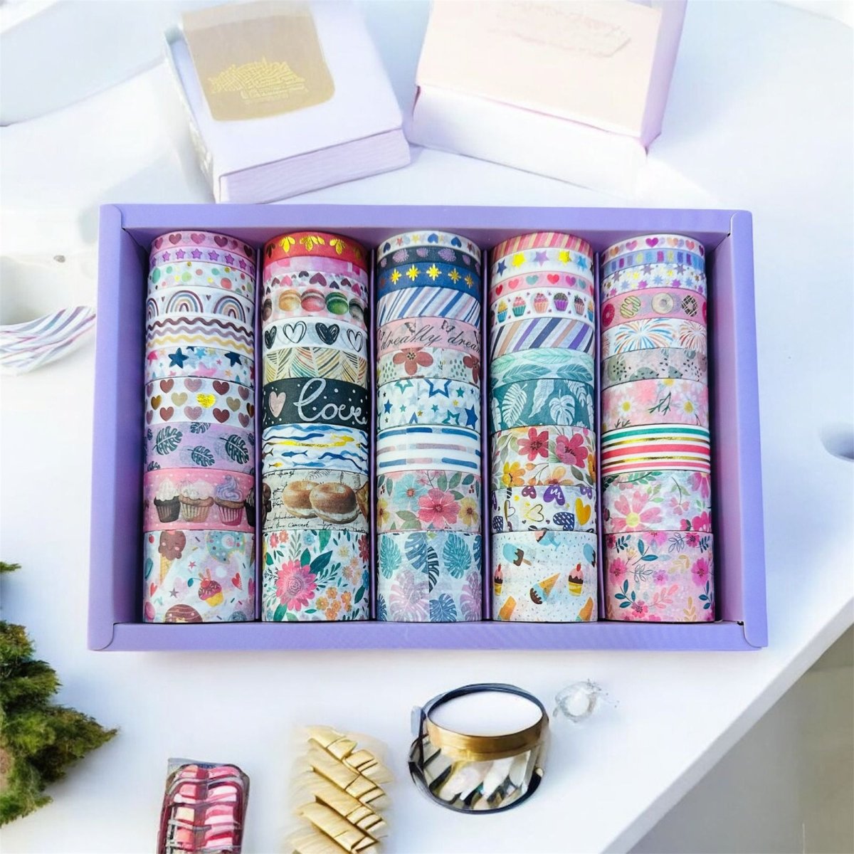 Star Pattern Washi Tape – 50 RollsDecorative Washi TapeCRAFTY CUDDLESet of colorful washi tapes in a purple box on a white surface with decorative items.washitape washitapelove washitapecollection papercrafts diycrafts journaling bulletjournal plannerdecor creativejournaling stationerylovers aestheticstationery