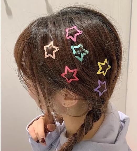 Colorful star-shaped hair clips on a person&
