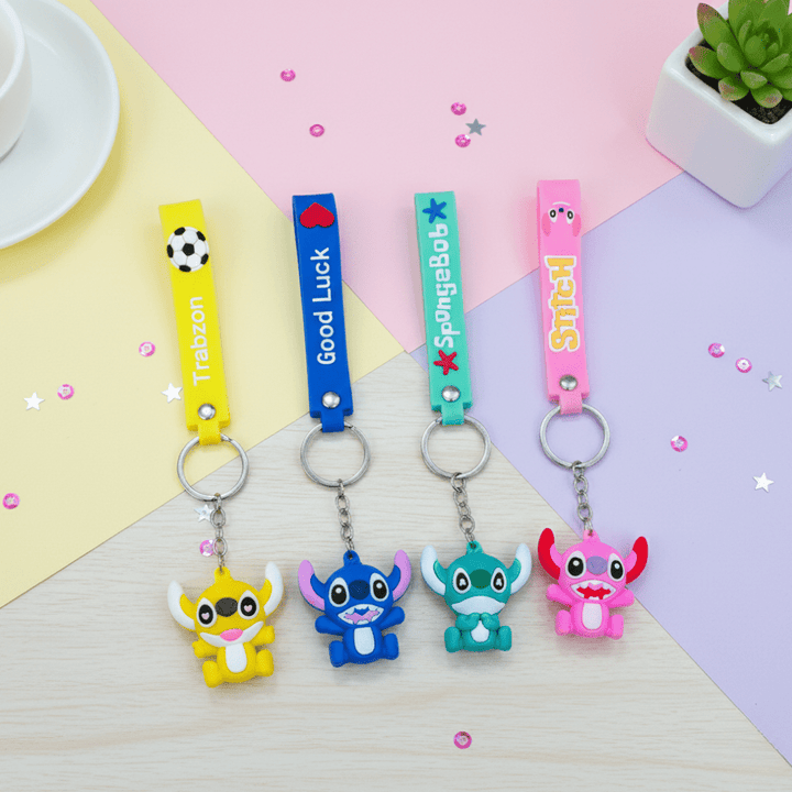 Stitch Theme Keychain with StrapKeychainsCRAFTY CUDDLEFour colorful keychains with cartoon characters on a pastel background1CartoonKeychain CuteKeyring MonsterKeychain KawaiiAccessories KidsBagCharm BackpackAccessory ReturnGifts TrendyKeychains SiliconeKeyring GiftForKids