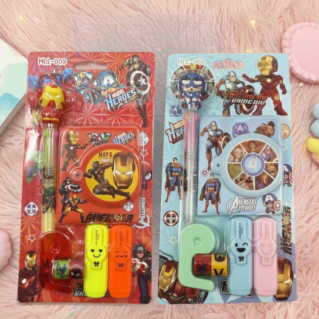 Superhero Kids Stationery Gift SetStationery SetsCRAFTY CUDDLETwo packages of stationery items with superhero designs on a pink textured background.Pack of 2 (Red & Sky Blue)BackToSchoolGearStationeryAddict