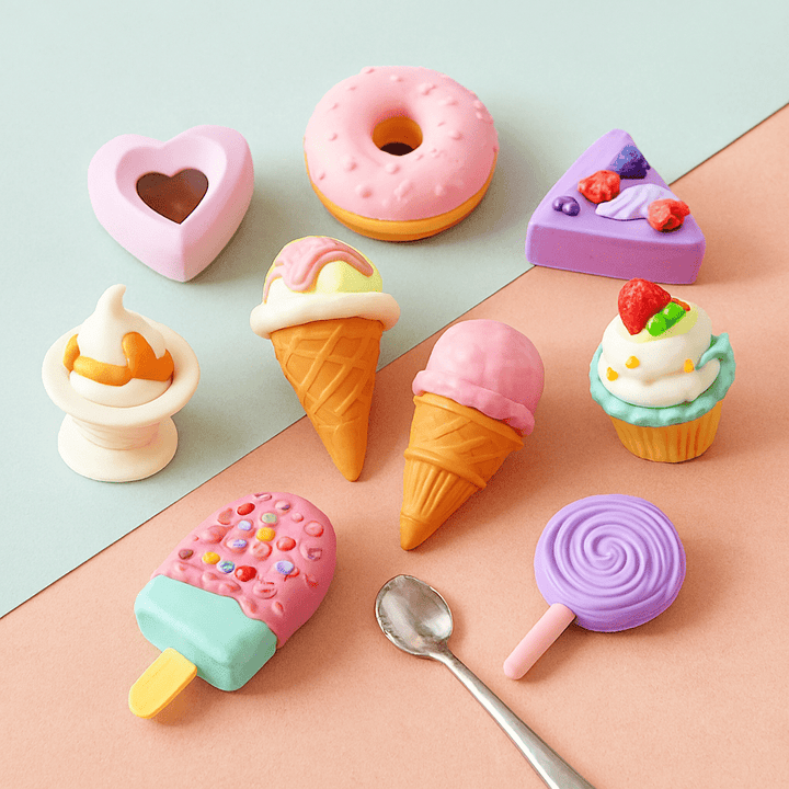 Colorful candy-shaped erasers on a pastel background