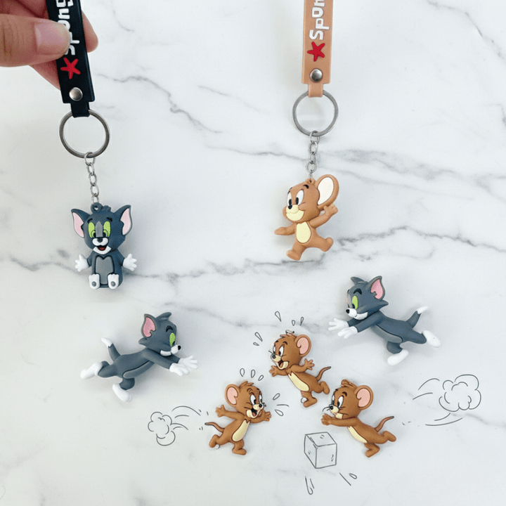 Tom &amp; Jerry Cartoon Silicone KeychainKeychainsCRAFTY CUDDLECartoon character keychains on a marble surface2 (1 Tom &amp; 1 Jerry)TomAndJerry CartoonKeychain CuteKeychain KeyringLove BagCharms AnimeAccessories KidsAccessories ReturnGiftIdeas TrendyKeychains GiftForKids