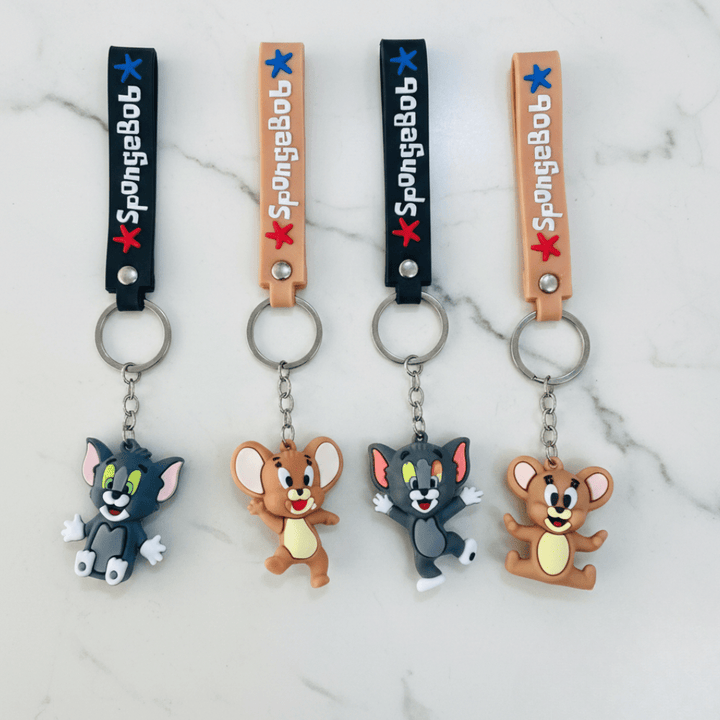 Tom &amp; Jerry Cartoon Silicone KeychainKeychainsCRAFTY CUDDLEFour keychains featuring cartoon characters on a marble surface2 (1 Tom &amp; 1 Jerry)TomAndJerry CartoonKeychain CuteKeychain KeyringLove BagCharms AnimeAccessories KidsAccessories ReturnGiftIdeas TrendyKeychains GiftForKids