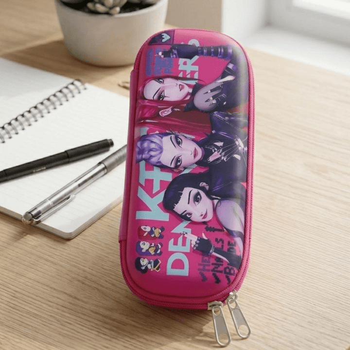 Trendy Girls EVA Pencil PouchPencil PouchCrafty CuddlePink pencil case with character design on a wooden surface with pens and a notebook.PinkGirlsPencilBox CuteStationery AestheticStationery PencilCase KidsStationery SchoolSupplies StationeryAddict EVAPencilBox TrendyStationery BackToSchoolStationeryAddict