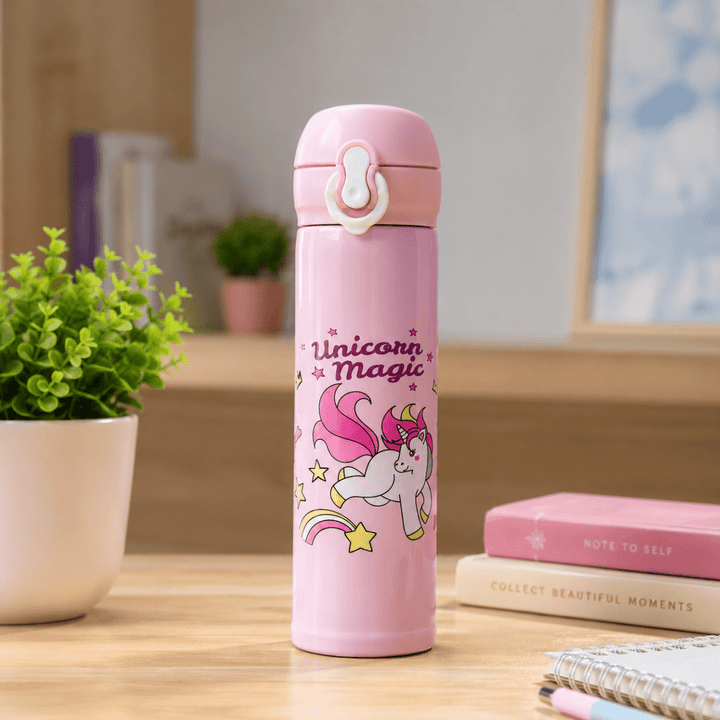 Unicorn Magic Kids Insulated Water BottleCartoon Kids Water BottleCrafty CuddlePink thermos bottle with unicorn design on a deskStationeryAddict