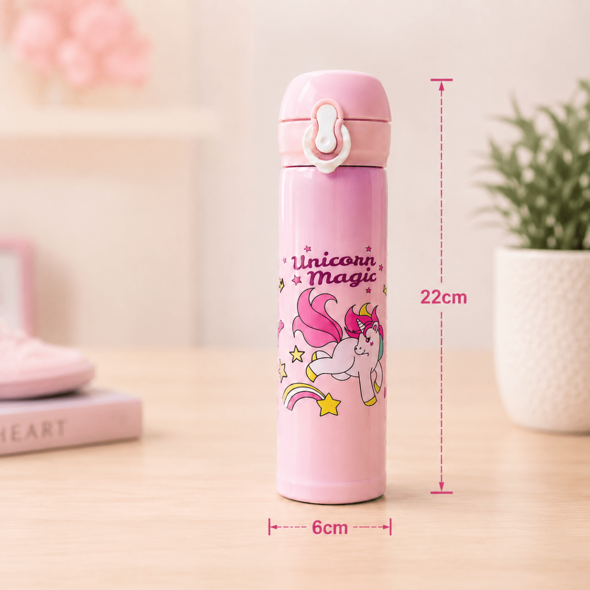 Unicorn Magic Kids Insulated Water BottleCartoon Kids Water BottleCrafty CuddlePink thermos bottle with unicorn design and measurements on a blurred backgroundStationeryAddict