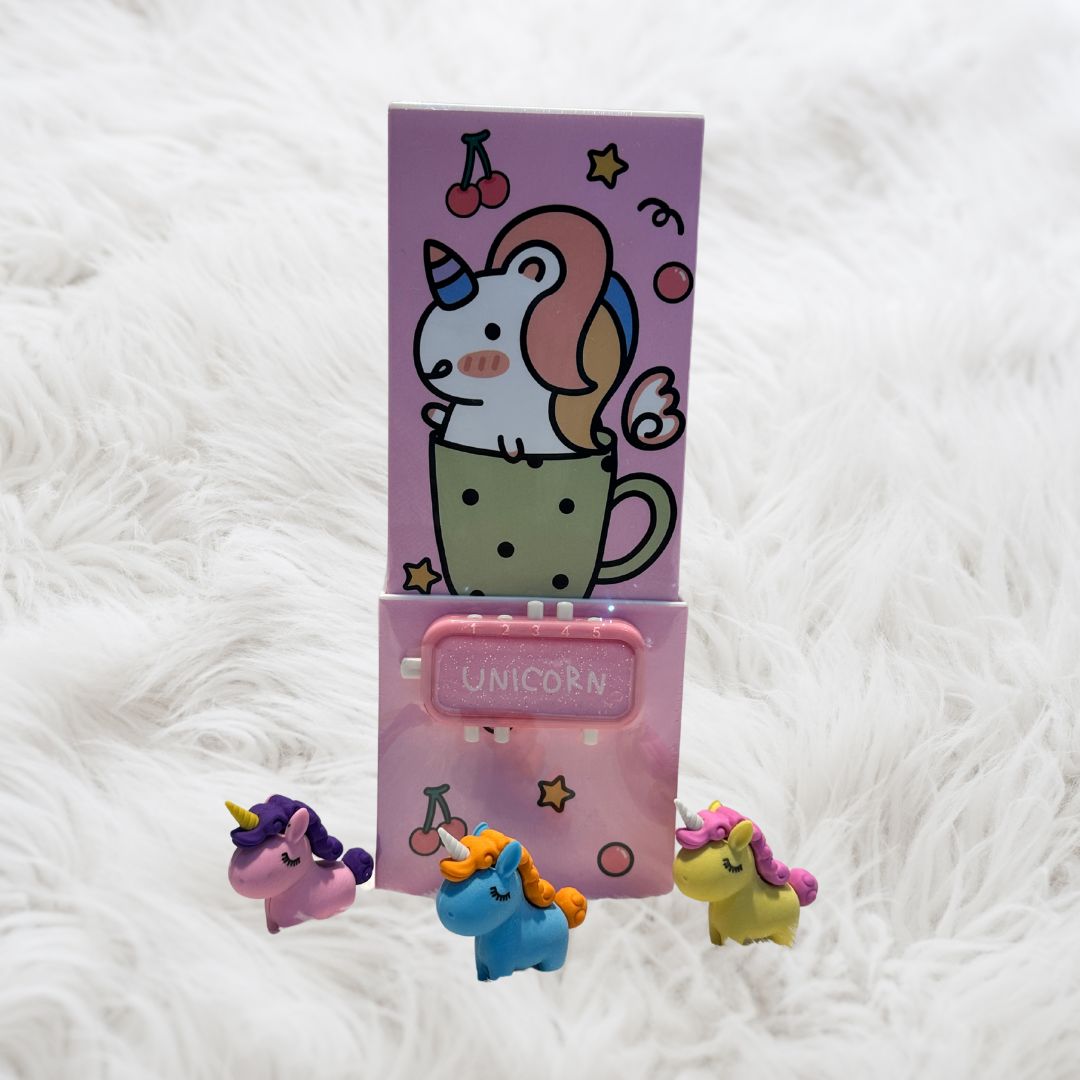Pink Unicorn Magic pop-up pen stand with a vibrant unicorn design, built-in mirror, and password lock, ideal for organizing stationery in style.
