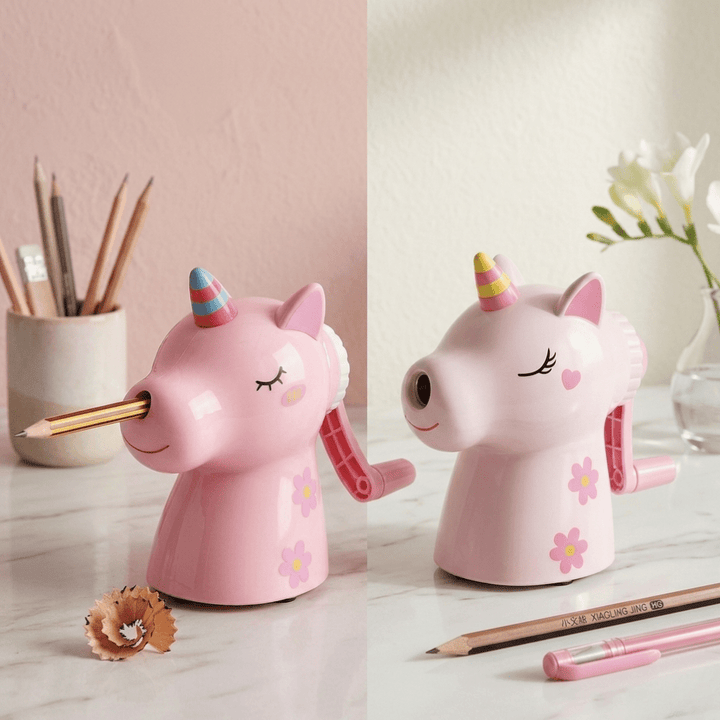 Unicorn Manual Pencil SharpenerCrafty CuddleTwo pink unicorn - shaped pencil sharpeners on a desk with stationery items.Unicorn Sharpener PinkPink
