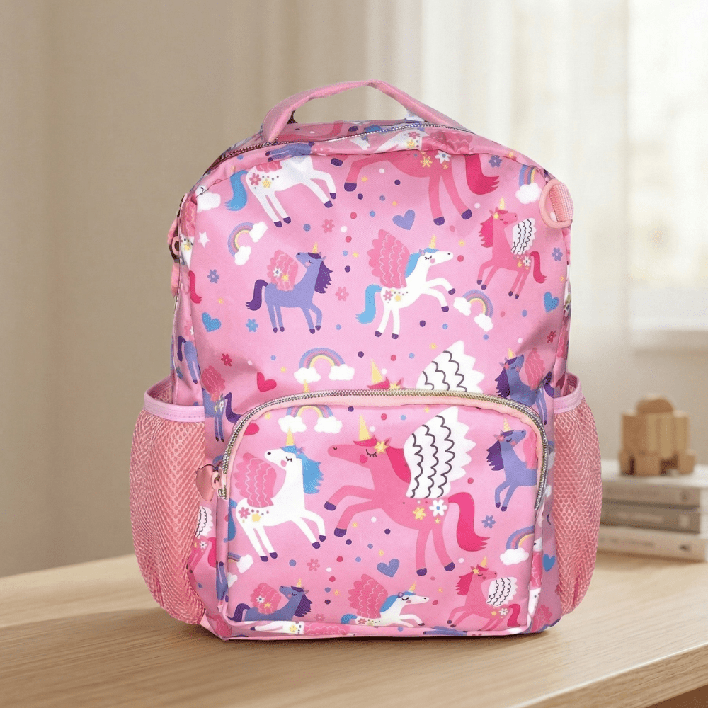 Vest Brand Unicorn Theme School BagCrafty CuddlePink backpack with unicorn pattern on a wooden surfaceUnicorn School Bag-1Pink