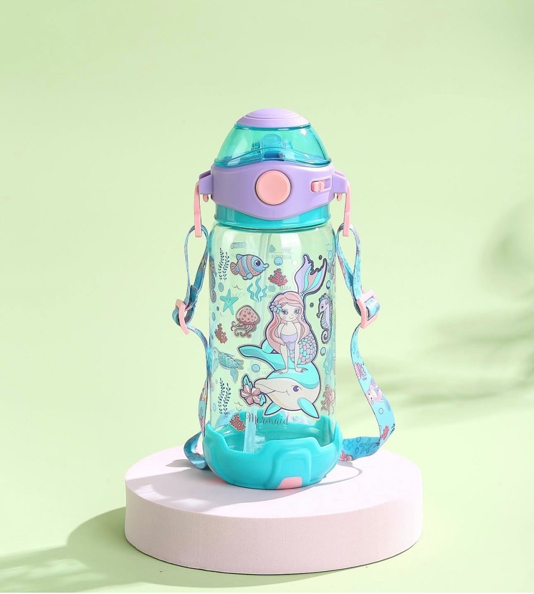 650 ml VEST kids bottle with mermaid and sea creature print, flip-top sipper lid, and adjustable shoulder strap.