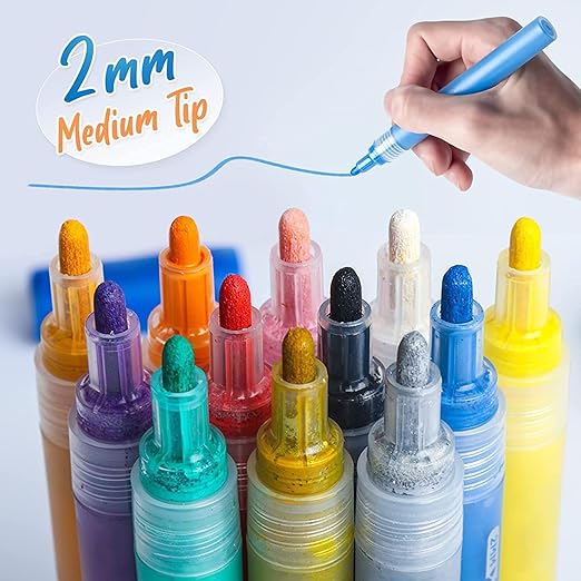 Close-up of 2mm medium tip acrylic marker applying paint on canvas

