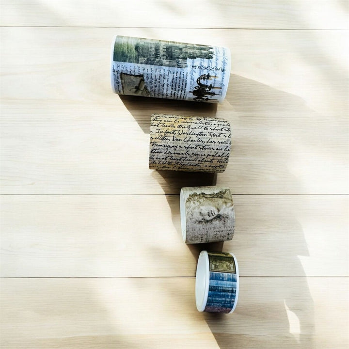 Vintage Text Washi Tape Set - 18 RollsDecorative Washi TapeCRAFTY CUDDLEFour rolls of decorative tape with newspaper print on a wooden surfacePast Events Boxwashitape washitapelove washitapeaddict vintagestationery retrostationery newspaperstyle journaling junkjournal scrapbooking artjournaling creativejournaling aestheticstationery stationerylovers