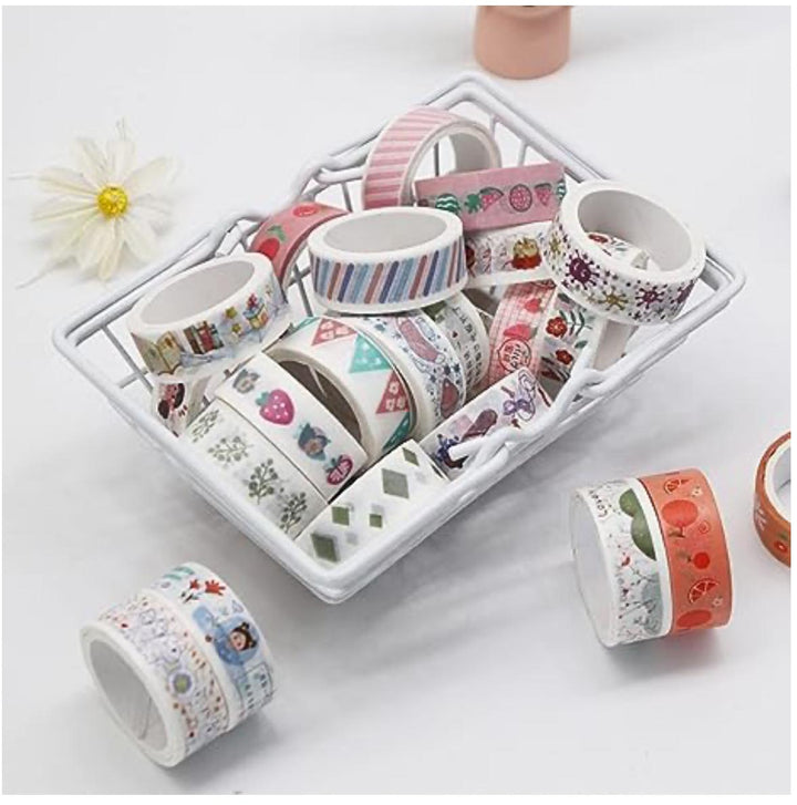 Set of decorative tape rolls on a white tray with a white background